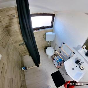 an overhead view of a bathroom with a toilet and a sink at Ada Bojana Green in Ulcinj