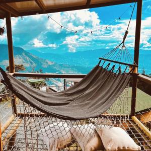 a hammock with a view of the mountains at Monte Santa Elena in Medellín