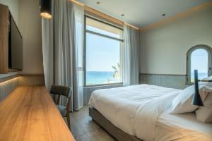 Posteľ alebo postele v izbe v ubytovaní KING MINOS RETREAT Resort & Spa