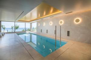 a swimming pool in the middle of a house at KING MINOS RETREAT Resort & Spa in Hersonissos