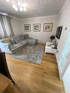 a living room with a couch and a television at 1 Bedroom property in East London in London