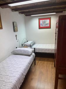 Postel nebo postele na pokoji v ubytování Antico Oratorio dei Razza