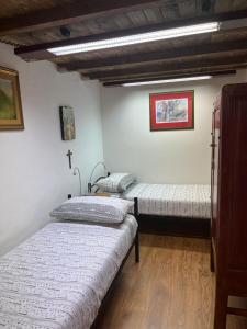 Postel nebo postele na pokoji v ubytování Antico Oratorio dei Razza