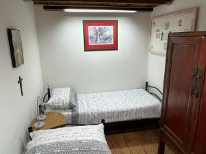 Postel nebo postele na pokoji v ubytování Antico Oratorio dei Razza