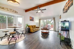 a living room with a couch and a table at Pet-Friendly Reno Hideaway with Private Hot Tub! in Reno