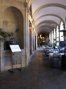 a hallway with tables and chairs in a building at Oasis Near Barcelona Pool Tennis Beach in Sant Andreu de Llavaneres