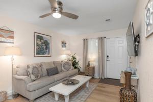 a living room with a couch and a table at Gulf Breeze Home/Remodeled 2Bdr in Gulf Breeze