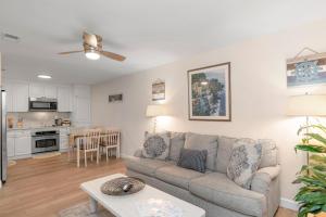 a living room with a couch and a table at Gulf Breeze Home/Remodeled 2Bdr in Gulf Breeze