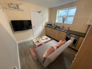 an overhead view of a small kitchen with a couch at The Oxford Avenue in Southampton