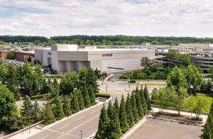 an aerial view of a building with trees at Hilton Short Hills in Short Hills