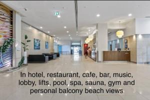 a hospital lobby with a sign on the floor at Absolute Beachfront at the Pier Glenelg in Adelaide