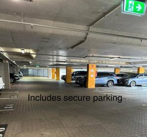 a parking lot with cars parked in a parking garage at Absolute Beachfront at the Pier Glenelg in Adelaide