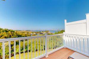 a balcony with a view of the ocean at Seaside Village --- #3 in Ocean City