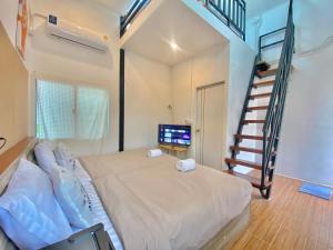 Postel nebo postele na pokoji v ubytování ดูดาวแคมป์ริมโขง