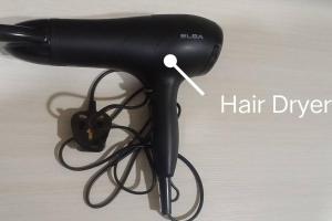 a hair dryer with a cord attached to it at Sakura Homestay 4 bedrooms 14pax- Eaton Hills Padang Kerbau Miri in Miri