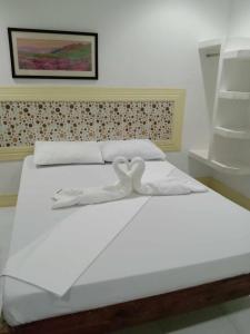 Postel nebo postele na pokoji v ubytování Bountiful Inn