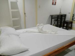 Postel nebo postele na pokoji v ubytování Bountiful Inn