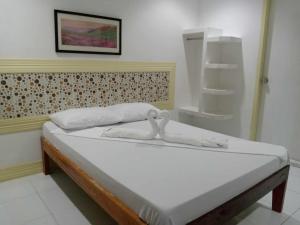 Postel nebo postele na pokoji v ubytování Bountiful Inn