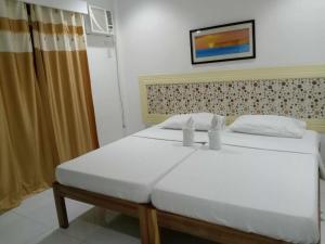 Postel nebo postele na pokoji v ubytování Bountiful Inn