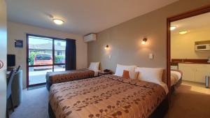 Postel nebo postele na pokoji v ubytování Airways Motel