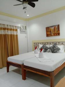 Postel nebo postele na pokoji v ubytování Bountiful Inn
