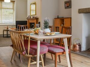 a dining room table with a plate of food on it at Lavender House in Barnoldswick