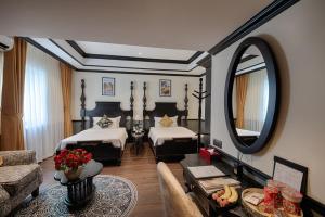 Letto o letti in una camera di Monarque Hotel Danang