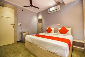 A bed or beds in a room at Hotel Kanchan Residency