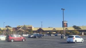 a parking lot with cars parked in front of a building at 1 bedroom condo F1 / Superbowl Availability in Las Vegas