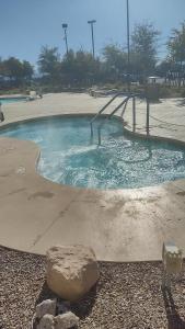 a swimming pool with a slide in a park at 1 bedroom condo F1 / Superbowl Availability in Las Vegas