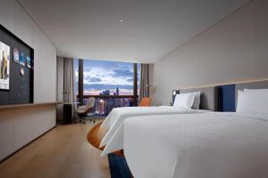 Letto o letti in una camera di Hampton by Hilton Shenzhen Futian Port