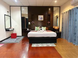 a bedroom with a large bed in a room at The Sun House in Hua Hin