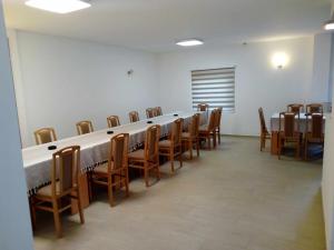 a large room with a long table and chairs at STD Cvetković in Crni Vrh