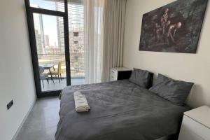 a bedroom with a large bed and a large window at Ultra luxurious 1Bd,High floor,with balcony in Istanbul