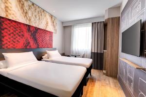 Postel nebo postele na pokoji v ubytování ibis PJCC Petaling Jaya