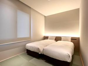Postel nebo postele na pokoji v ubytování ABiz hotel