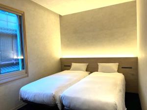Postel nebo postele na pokoji v ubytování ABiz hotel
