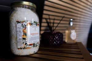 a glass jar filled with rice on a wooden table at North Coast 500 Pods in Achmelvich