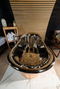 a bathroom sink sitting on top of a table at North Coast 500 Pods in Achmelvich