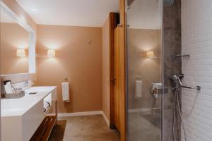 a bathroom with a shower and a sink at Akra Kemer - Ultra All Inclusive in Kemer