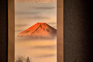 a painting of a mountain in the clouds at 飛騨高山 八軒町戸建 in Takayama