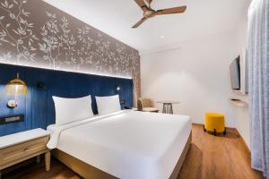 Postel nebo postele na pokoji v ubytování 7 Apple Hotel Jal Mahal, Jaipur