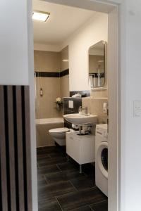Kuchyň nebo kuchyňský kout v ubytování JUNIK Apartments im Stadtzentrum