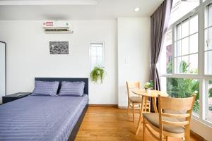 Postel nebo postele na pokoji v ubytování Cali Homestay