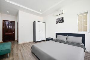 Postel nebo postele na pokoji v ubytování Cali Homestay