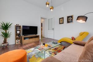 a living room with a couch and a tv at Apartment Jadera in Zadar