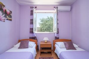 Posteľ alebo postele v izbe v ubytovaní Villa Planika