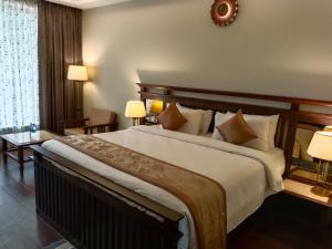 Ένα ή περισσότερα κρεβάτια σε δωμάτιο στο UVA Sands Beach Resort