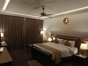 Ένα ή περισσότερα κρεβάτια σε δωμάτιο στο UVA Sands Beach Resort