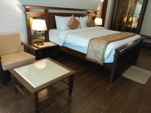 Ένα ή περισσότερα κρεβάτια σε δωμάτιο στο UVA Sands Beach Resort